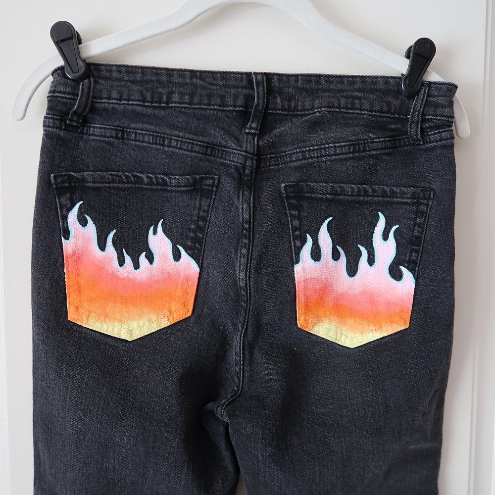 Black skinny jeans with hand painted pockets